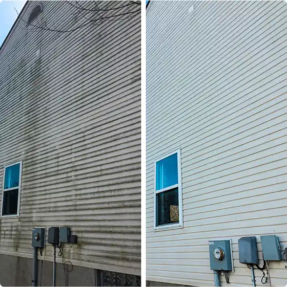 Dirty house siding cleaned to look like new.